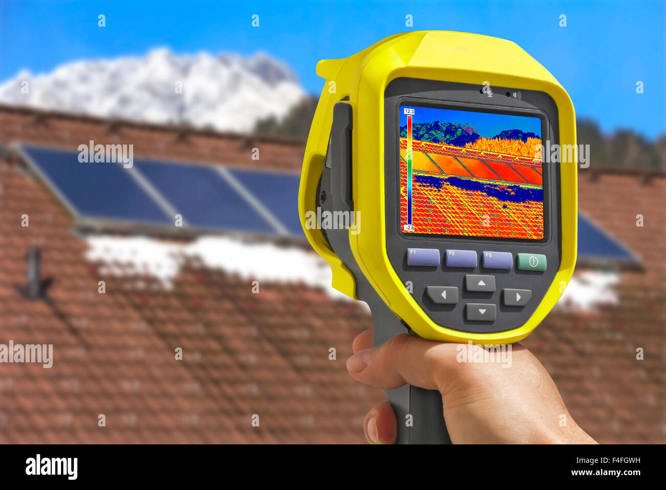 Recording Photovoltaic Solar Panels on the roof House With Thermal Camera Stock Photo