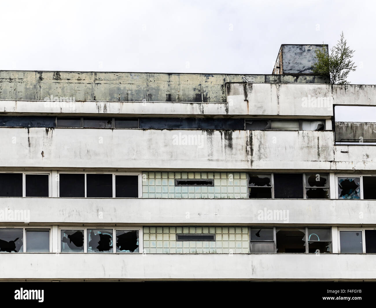 Abandoned, derelict highrise apartment residential tower block building MDU detail Stock Photo