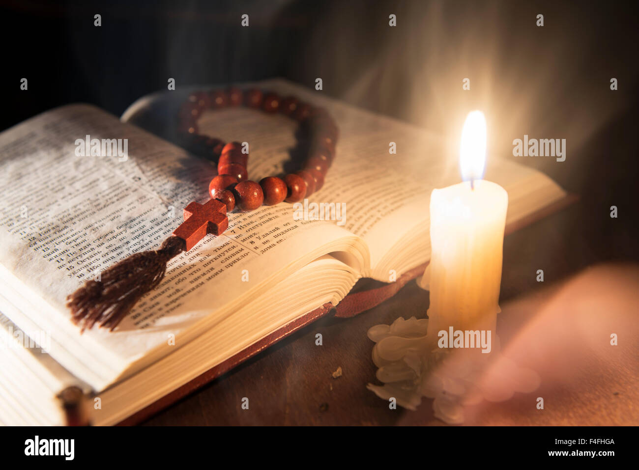 holy book and cross on a wooden background Stock Photo