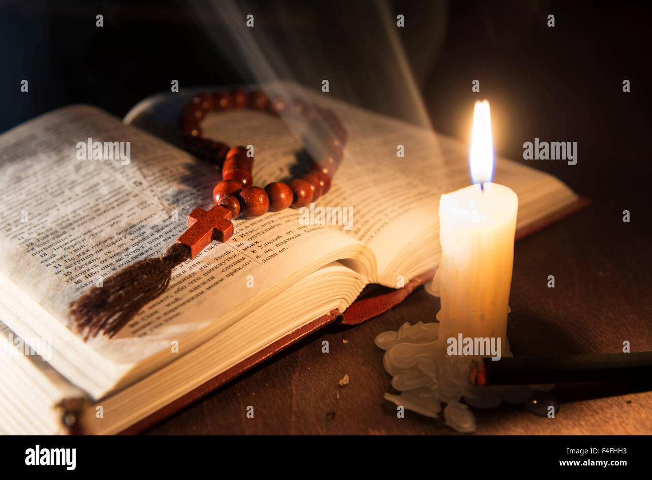 holy book and cross on a wooden background Stock Photo