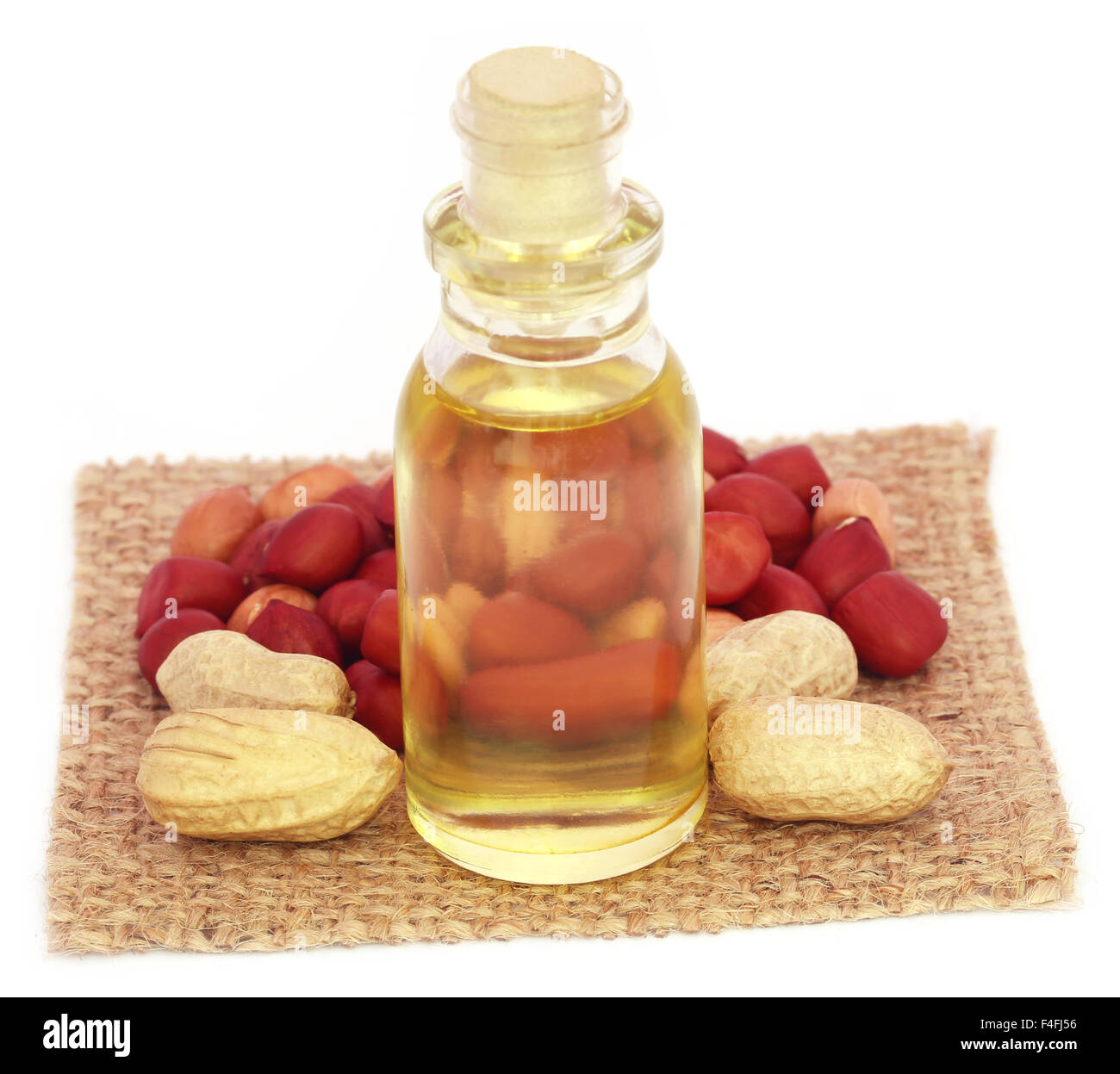 Fresh Peanuts with cooking oil over white background Stock Photo Alamy