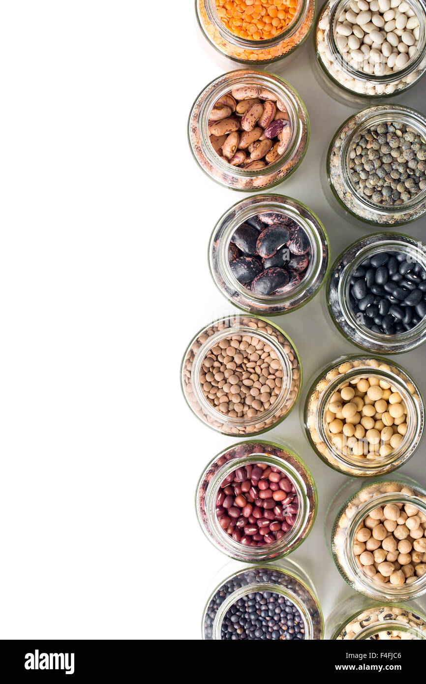 various dried legumes in jars on white background Stock Photo Alamy