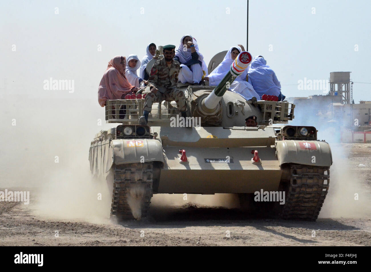 Quetta. 17th Oct, 2015. Female students ride on a tank during a weapon training session in southwest Pakistan's Quetta, Oct. 17, 2015. Authorities have commenced special weapon training sessions for female students of Sardar Bahadur Khan Women's University in Quetta. © Irfan/Xinhua/Alamy Live News Stock Photo
