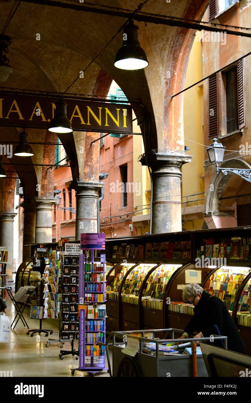 Woman perusing book stalls in the back streets of Bologna Italy Stock ...