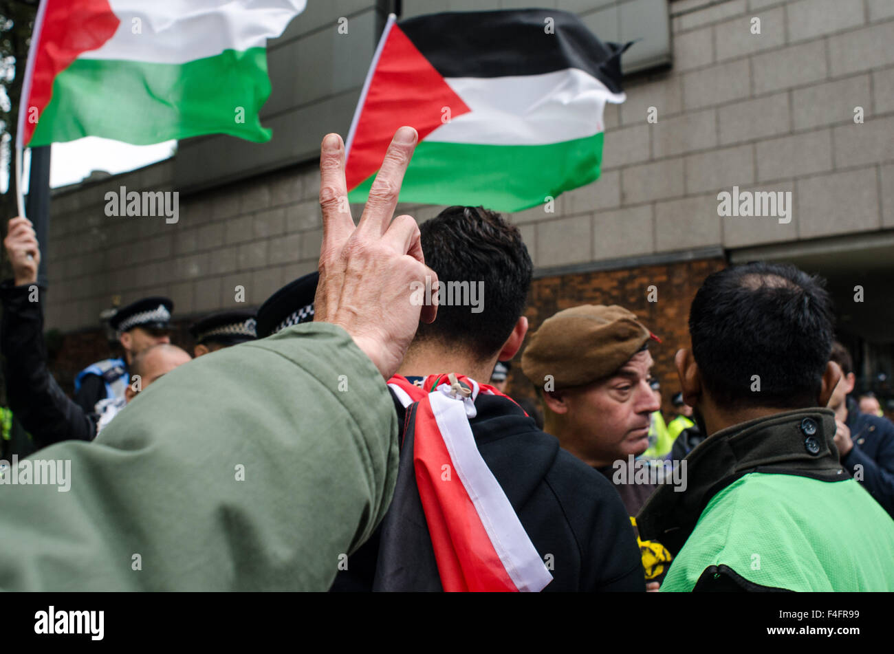 A single Israeli protester interrupts the 'Free Palestine' protest, by brandishing an Israeli flag. Stock Photo
