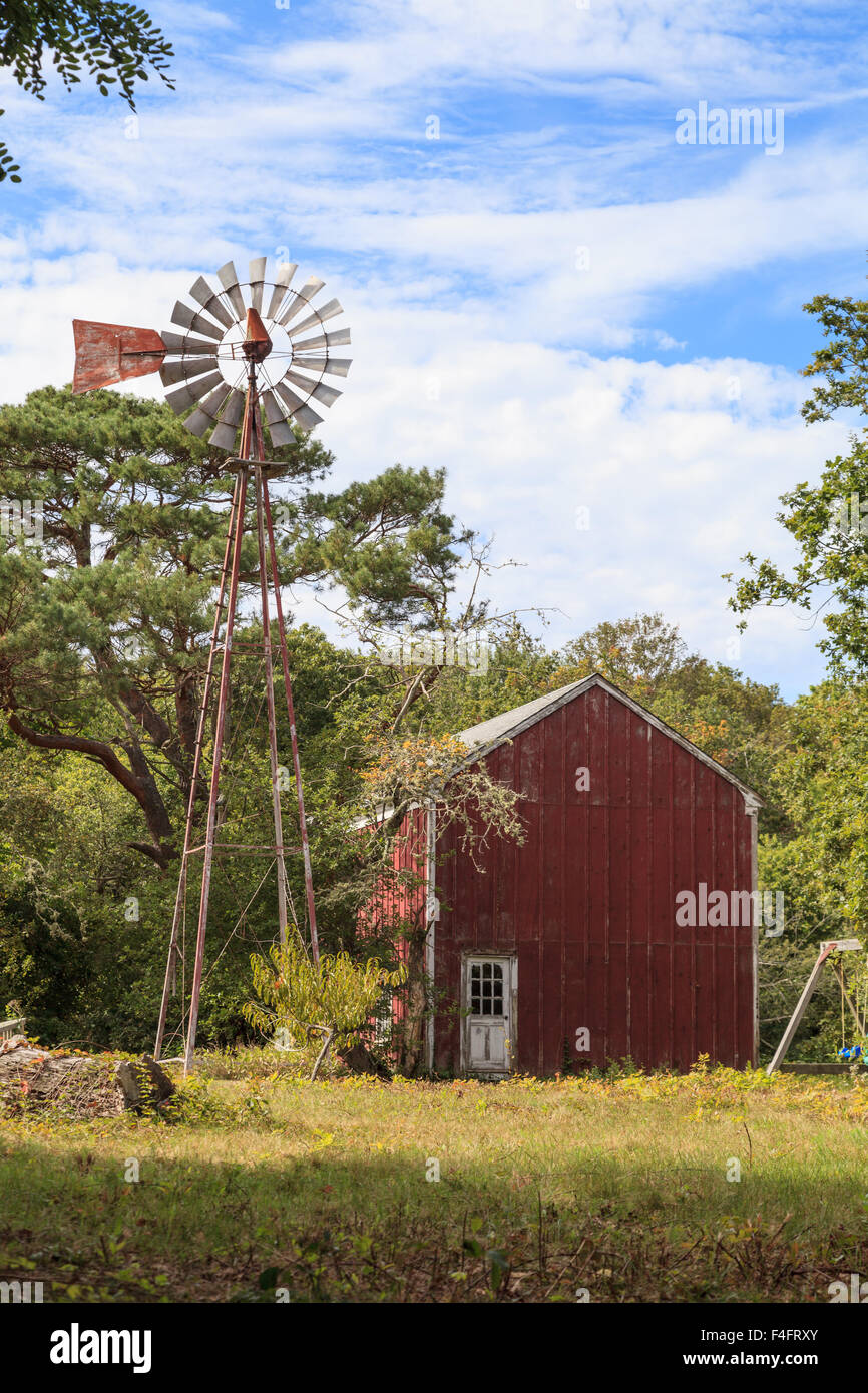 New England rustic barn in summer with a green grass lawn Stock Photo