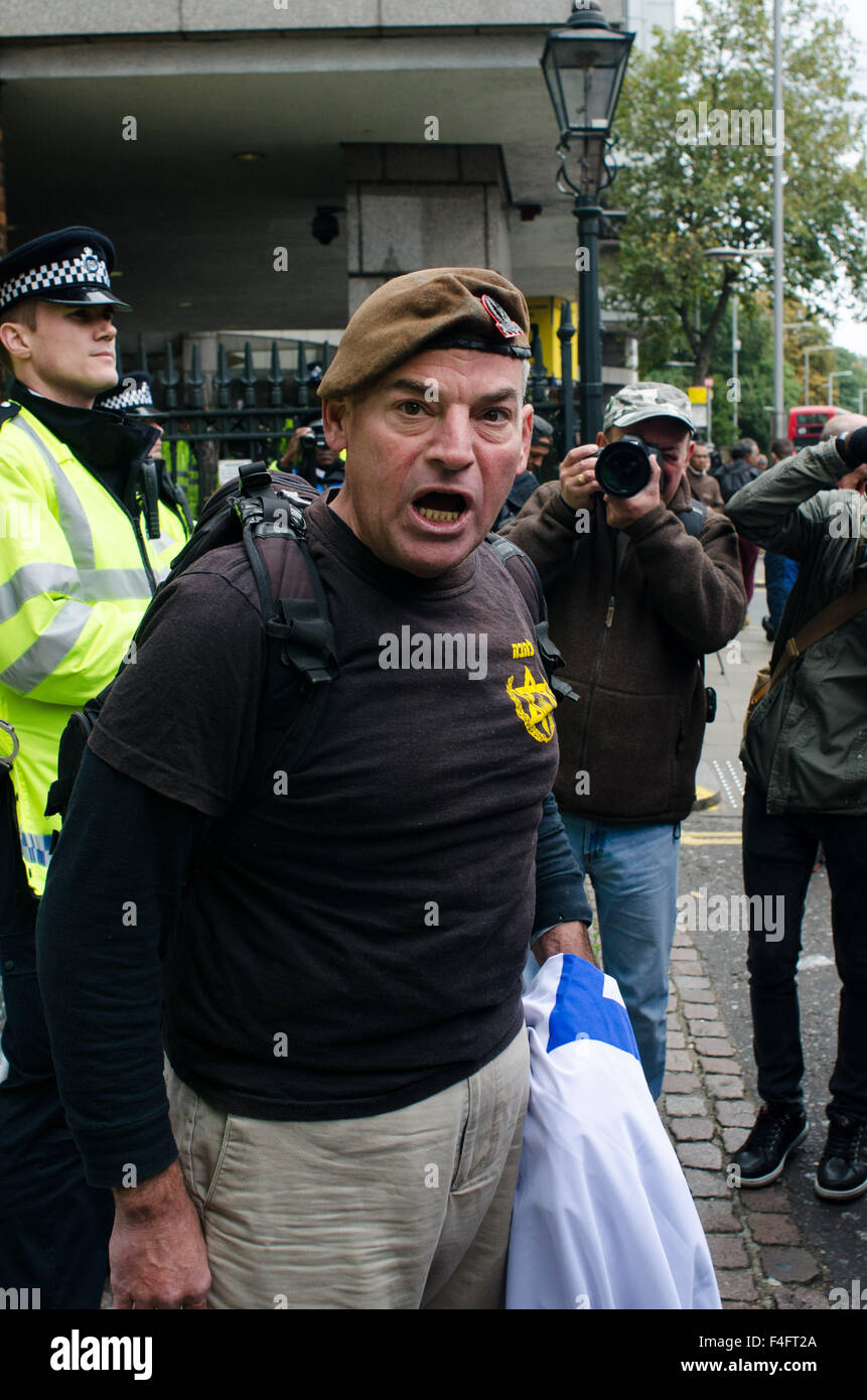 London, UK. 17th October, 2015. A single Israeli protester interrupts the 'Free Palestine' protest, by brandishing an Israeli flag. Credit:  Bertie Oakes/Alamy Live News Stock Photo