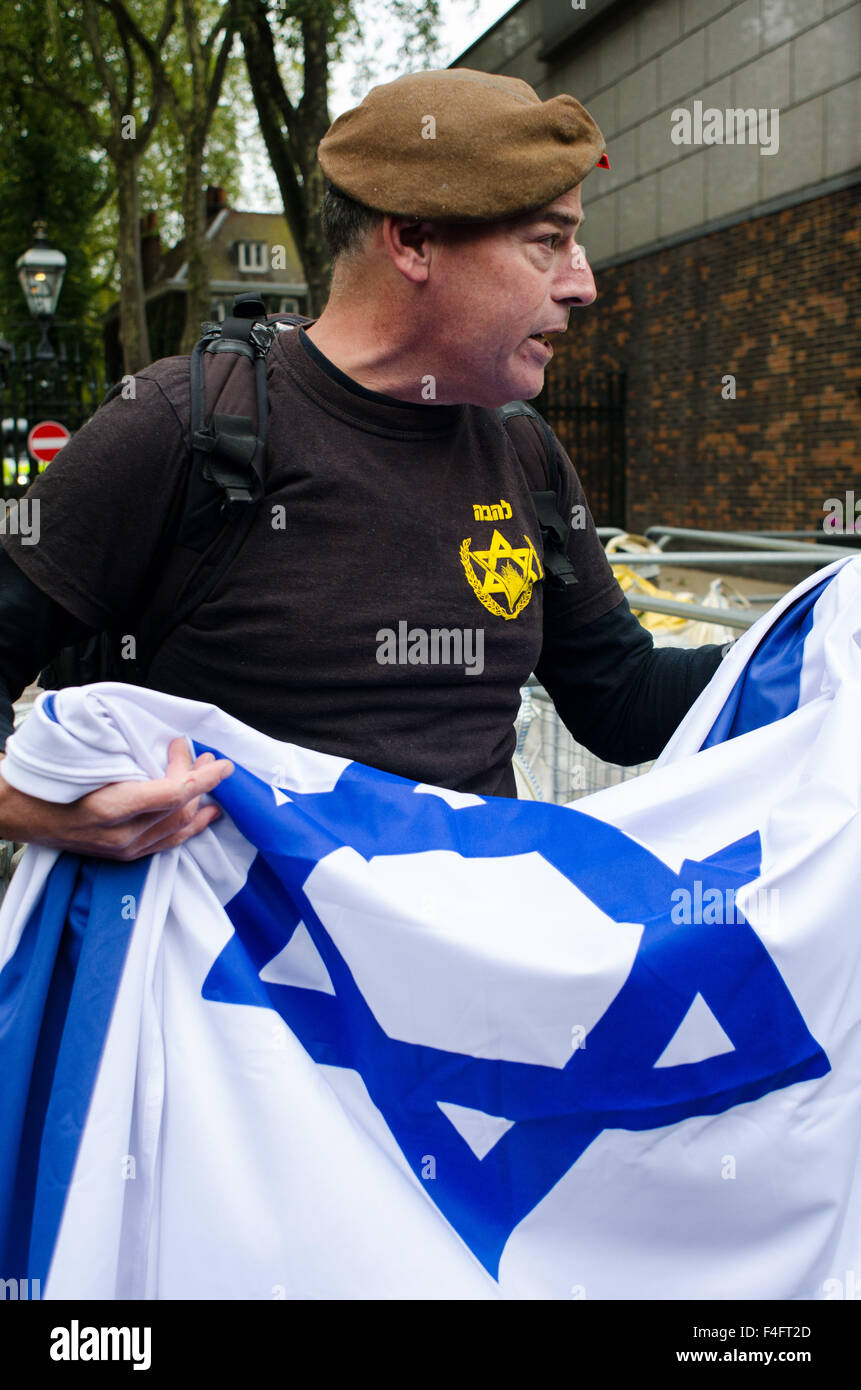 London, UK. 17th October, 2015. A single Israeli protester interrupts the 'Free Palestine' protest, by brandishing an Israeli flag. Credit:  Bertie Oakes/Alamy Live News Stock Photo