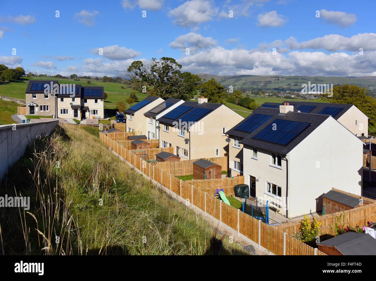 New affordable domestic housing with solar panels on roof. Fir Tree Rise, Kendal, Cumbria, England, United KIngdom, Europe. Stock Photo
