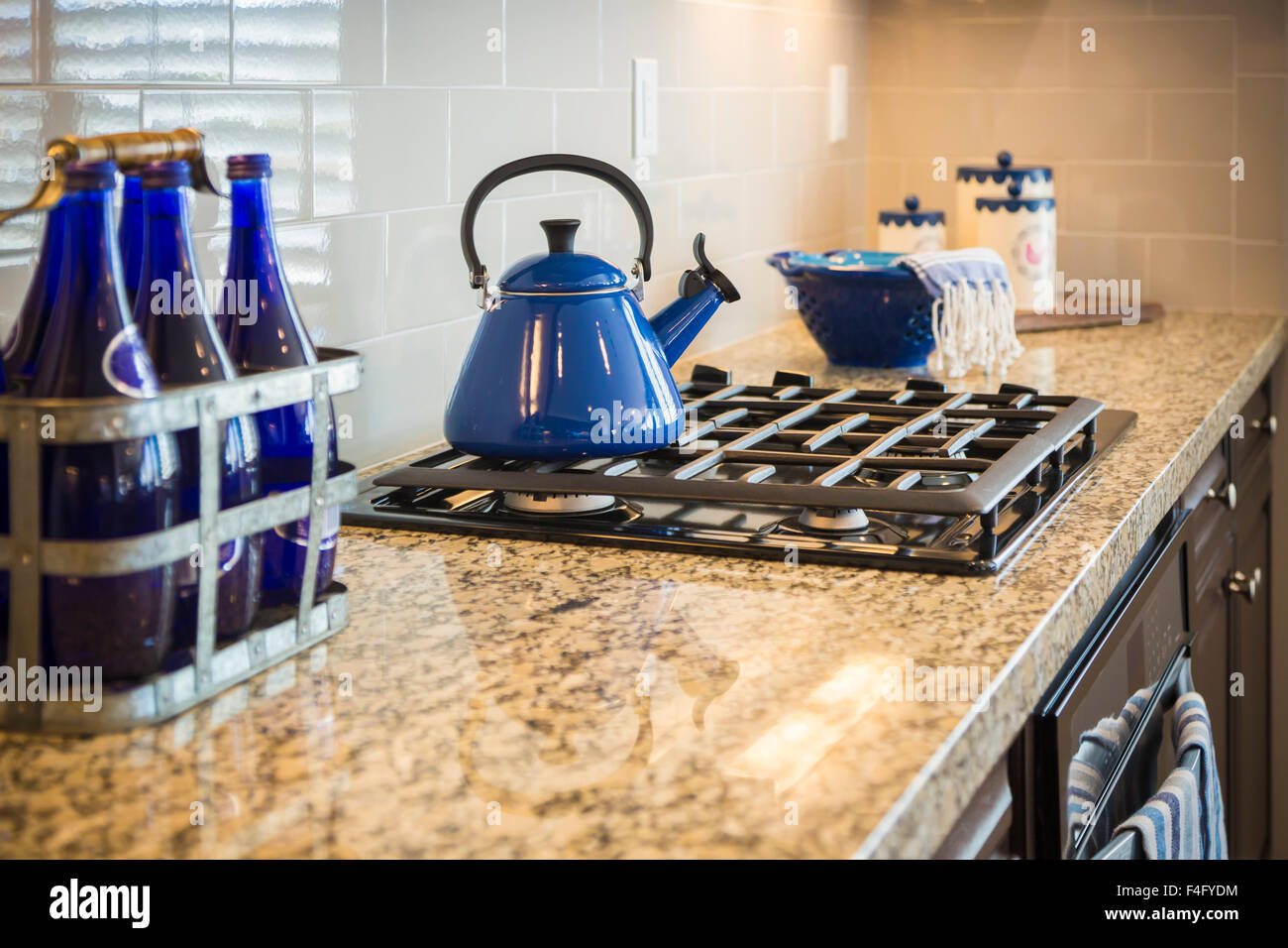 Bautiful Marble Kitchen Counter and Stove With Cobalt Blue Decor Stock