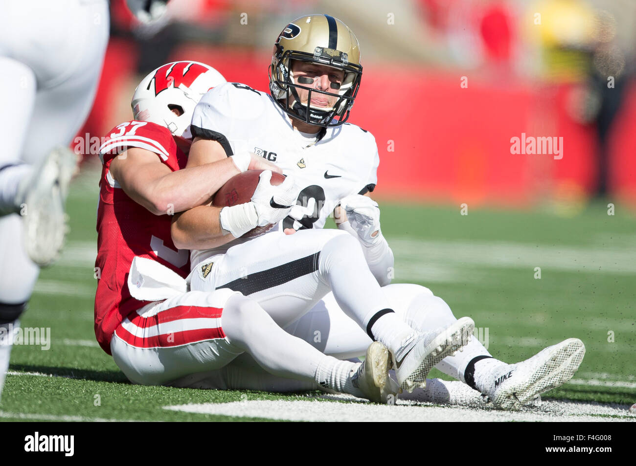 Madison, WI, USA. 17th Oct, 2015. Wisconsin Badgers safety Bret Verstegen #37 tackles Purdue Boilermakers wide receiver Danny Anthrop #33 during the NCAA Football game between the Purdue Boilermakers and the Wisconsin Badgers at Camp Randall Stadium in Madison, WI. John Fisher/CSM/Alamy Live News Stock Photo