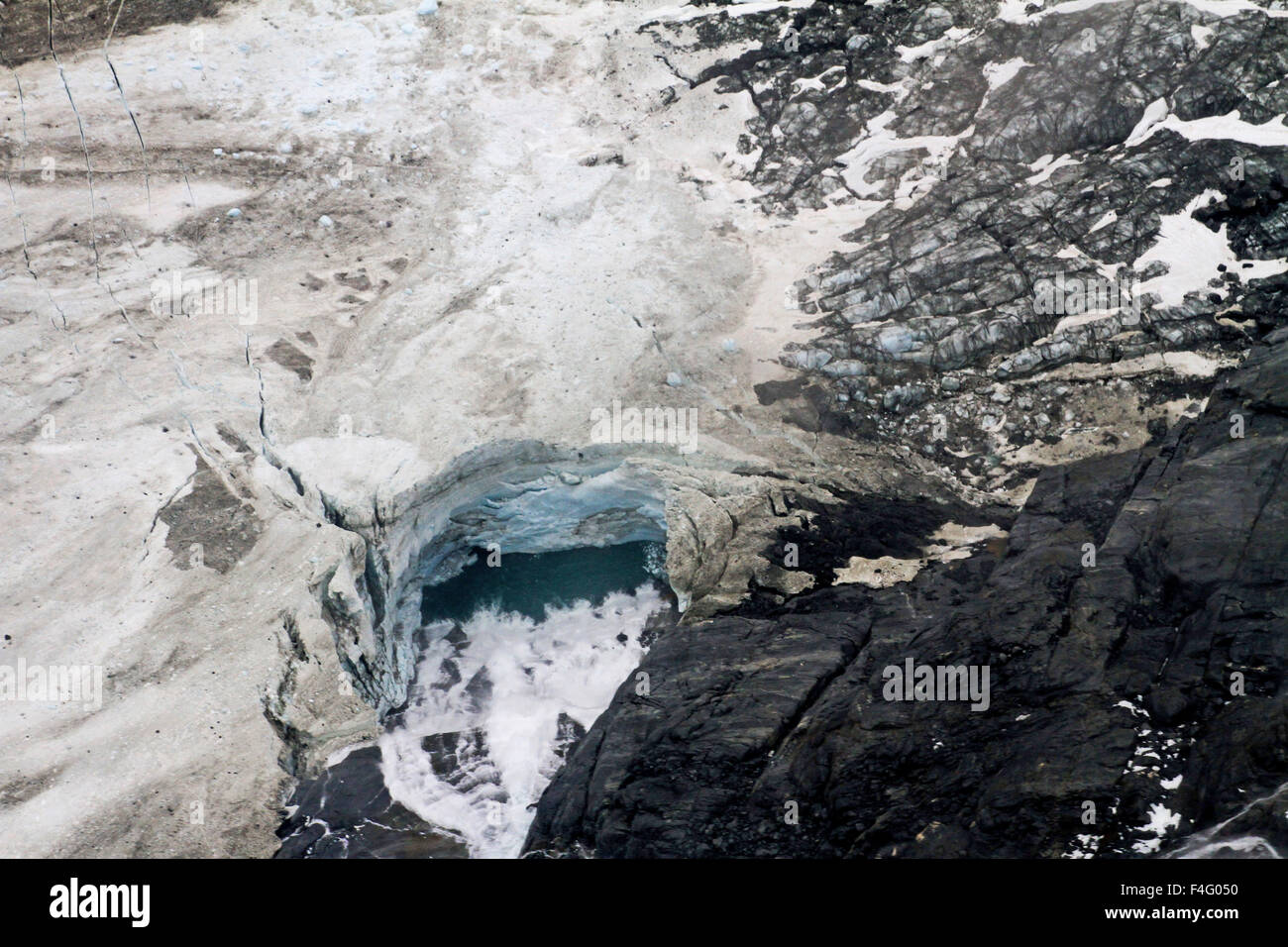 Aerial view of a waterfall on the Juneau Icefield/Mendenhall Glacier in Alaska Stock Photo