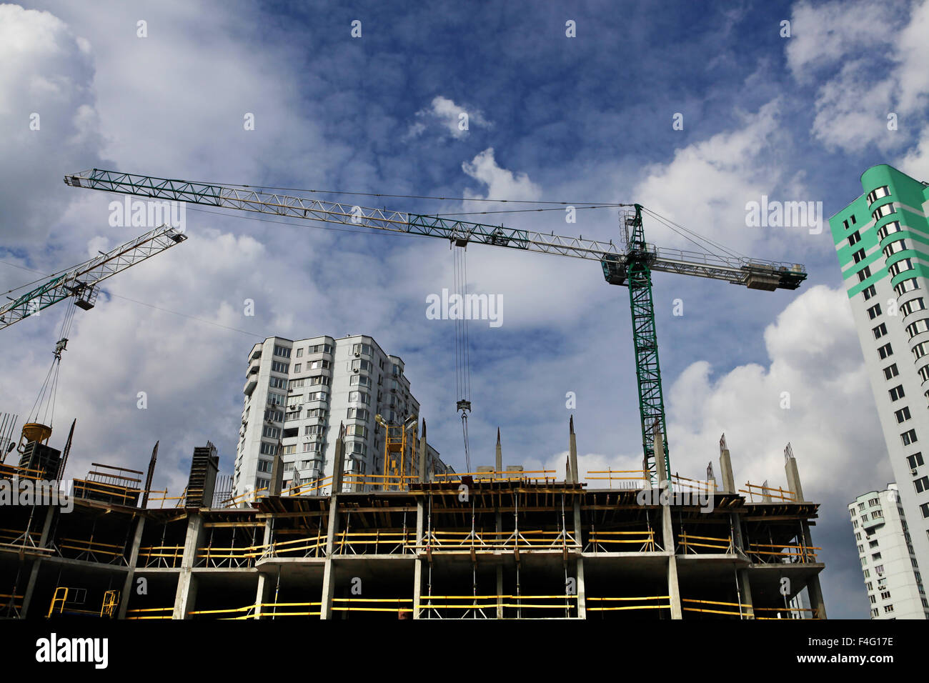 Inside place for many tall buildings under construction and cranes ...