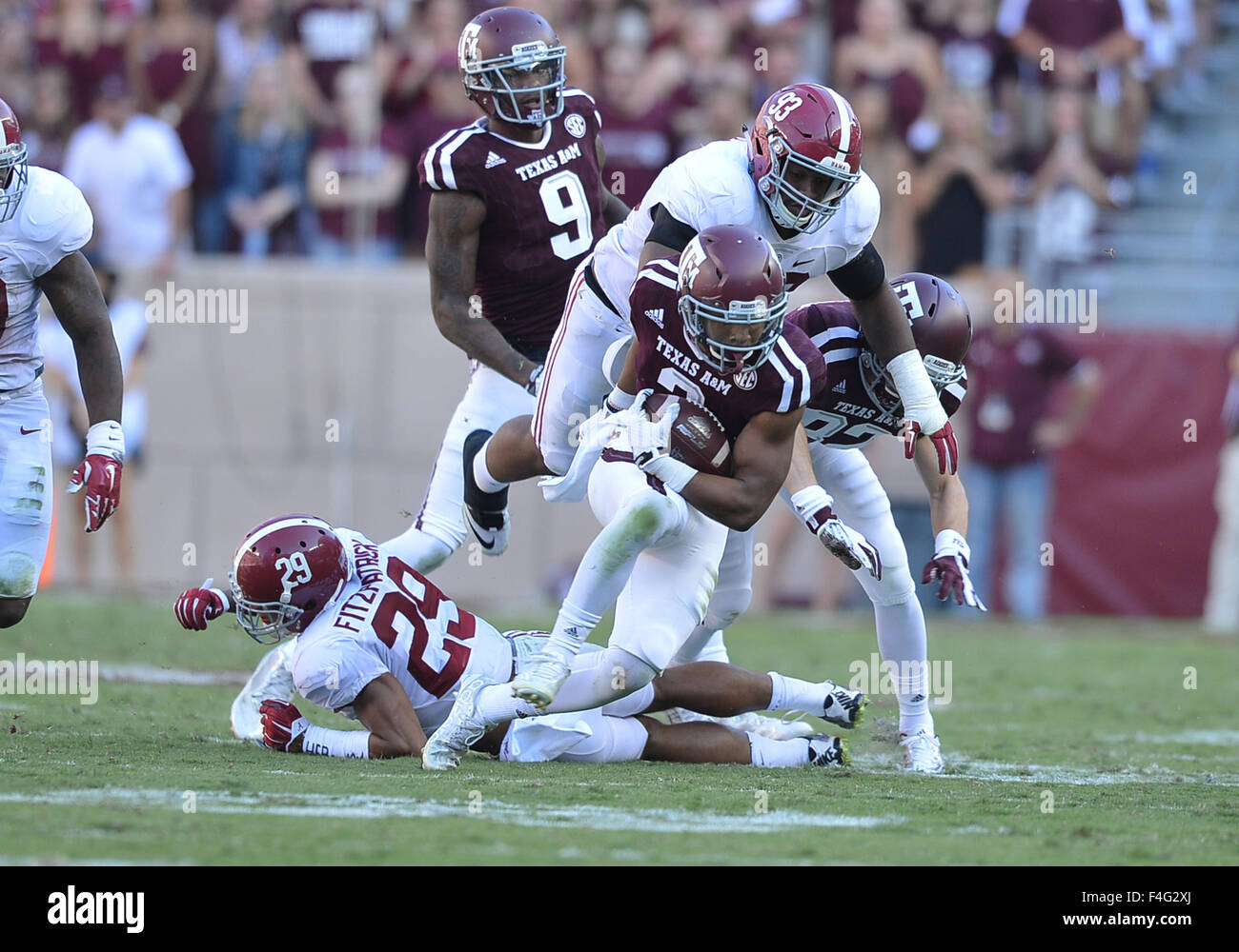 College Station, Texas, USA. 17th Oct, 2015. Texas A&M Aggies wide receiver Christian Kirk (3) gets some positive yardage and gets tackled by Alabama Crimson Tide defensive lineman Jonathan Allen (93) during the game between the Texas A&M Aggies and the Alabama Crimson Tide at Kyle Field in College Station, Texas. Alabama leads the first half against the Texas A&M, 28-13. Patrick Green/CSM/Alamy Live News Stock Photo
