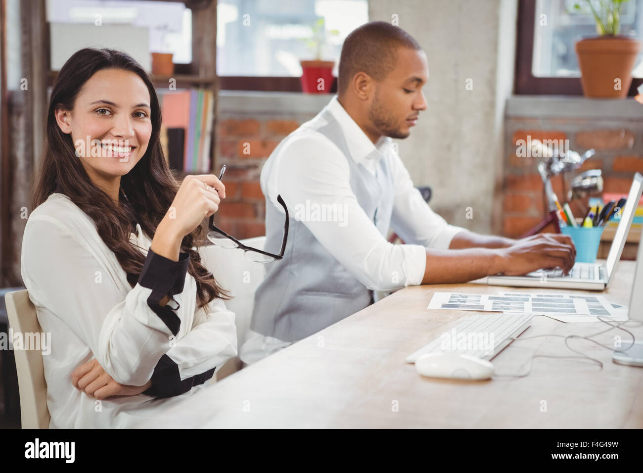 Woman holding eyeglasses Stock Photo