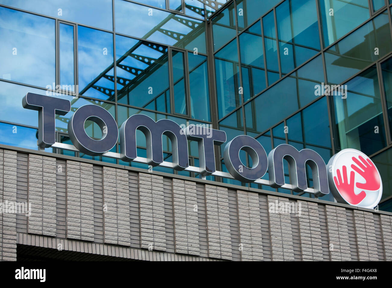 A logo sign outside of the headquarters of TomTom NV in Amsterdam