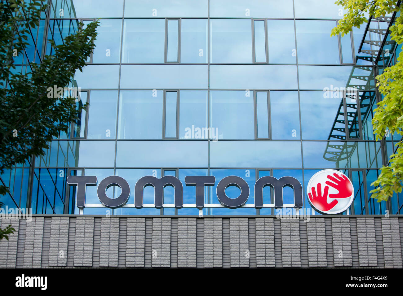 A logo sign outside of the headquarters of TomTom NV in Amsterdam