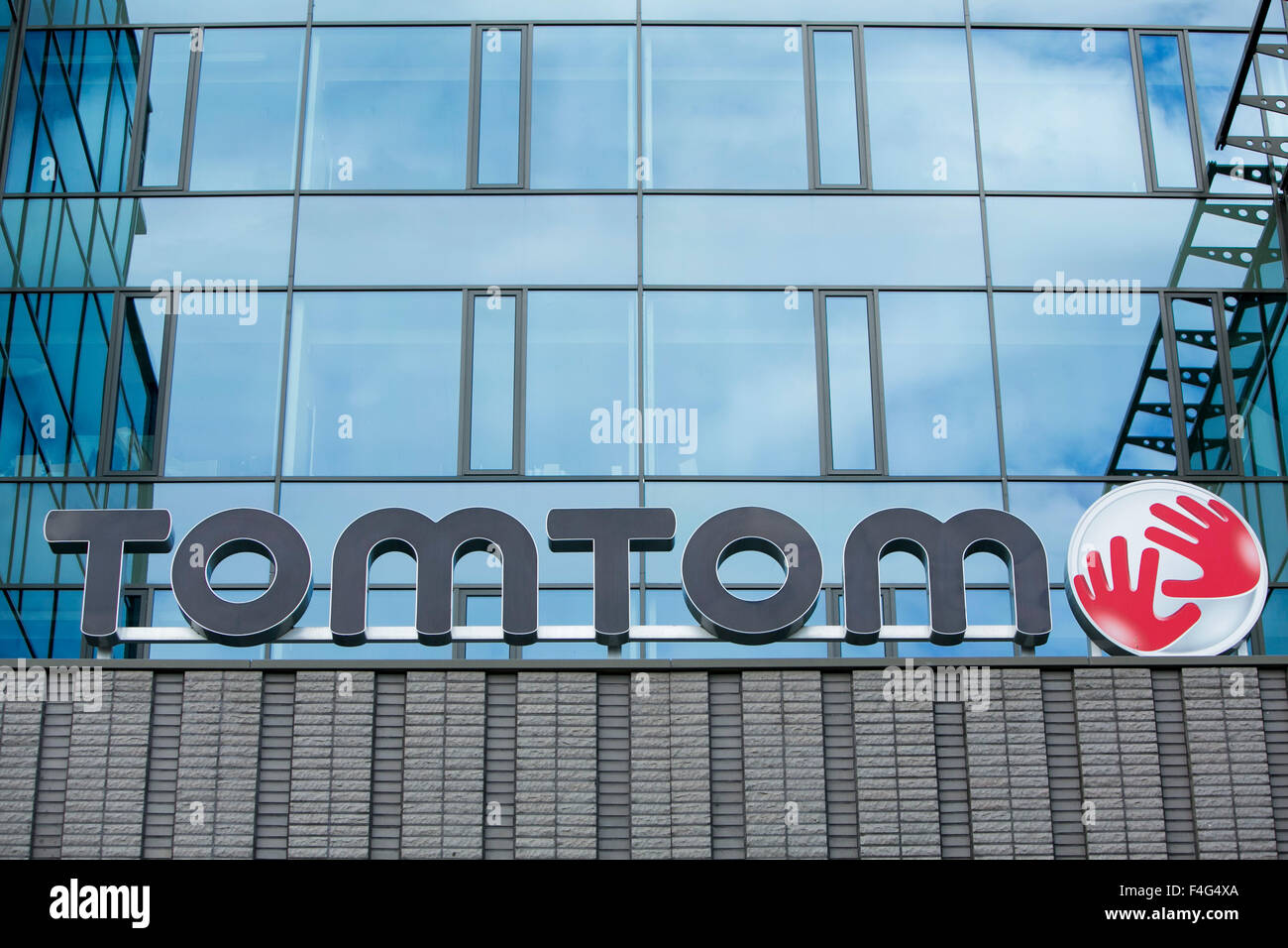 A logo sign outside of the headquarters of TomTom NV in Amsterdam