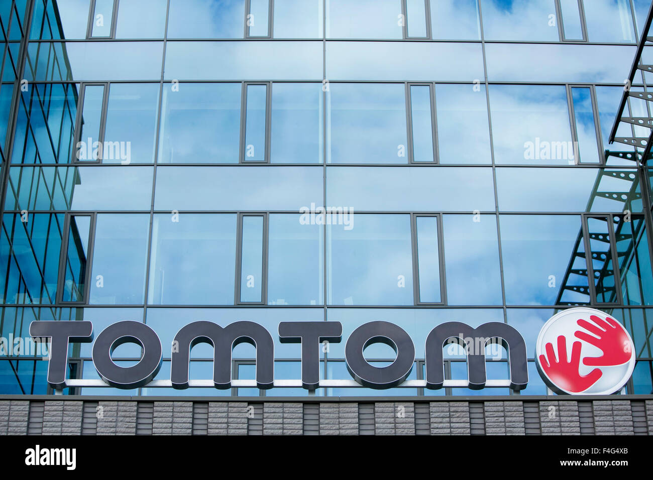 A logo sign outside of the headquarters of TomTom NV in Amsterdam