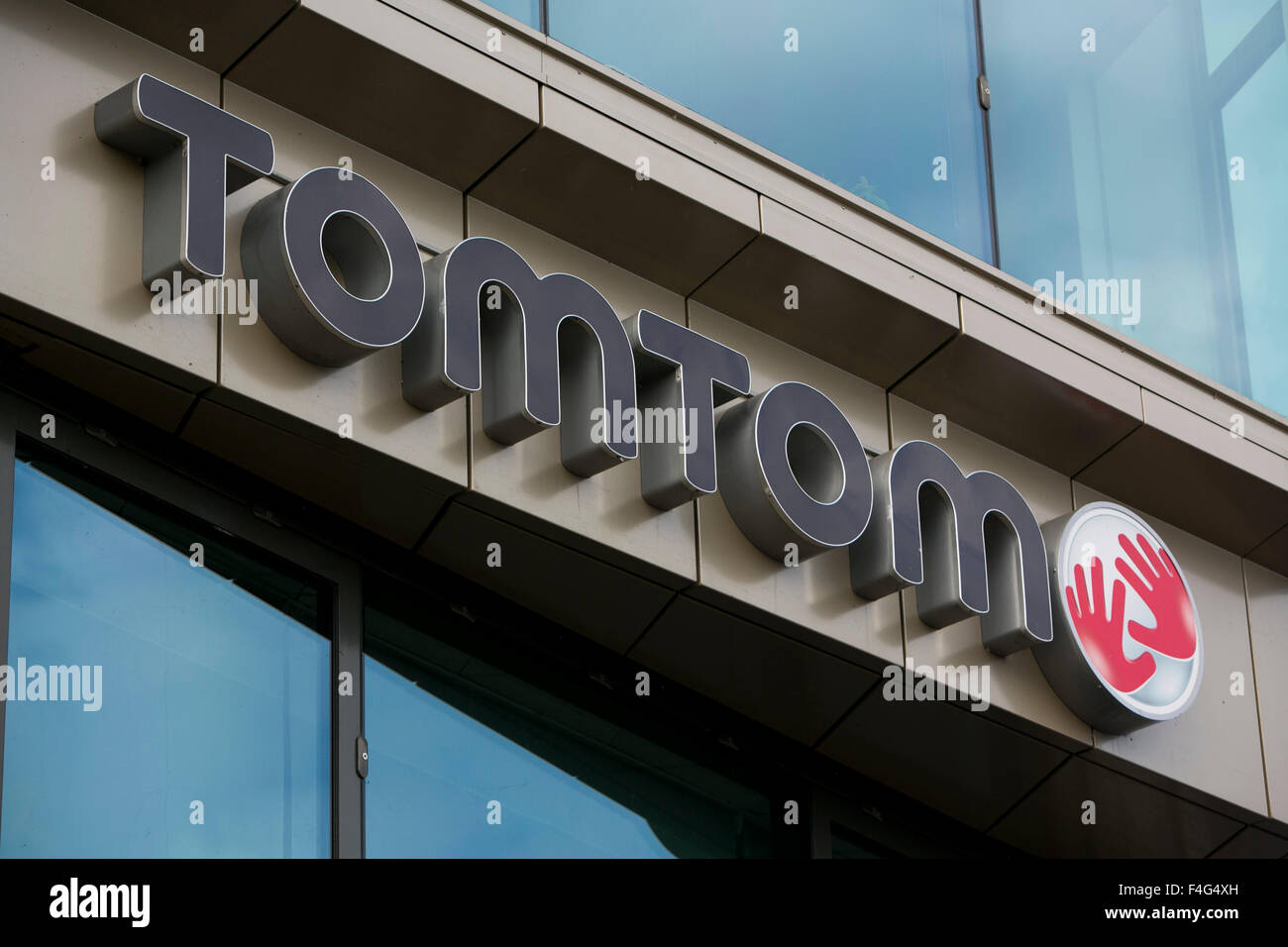 A logo sign outside of the headquarters of TomTom NV in Amsterdam