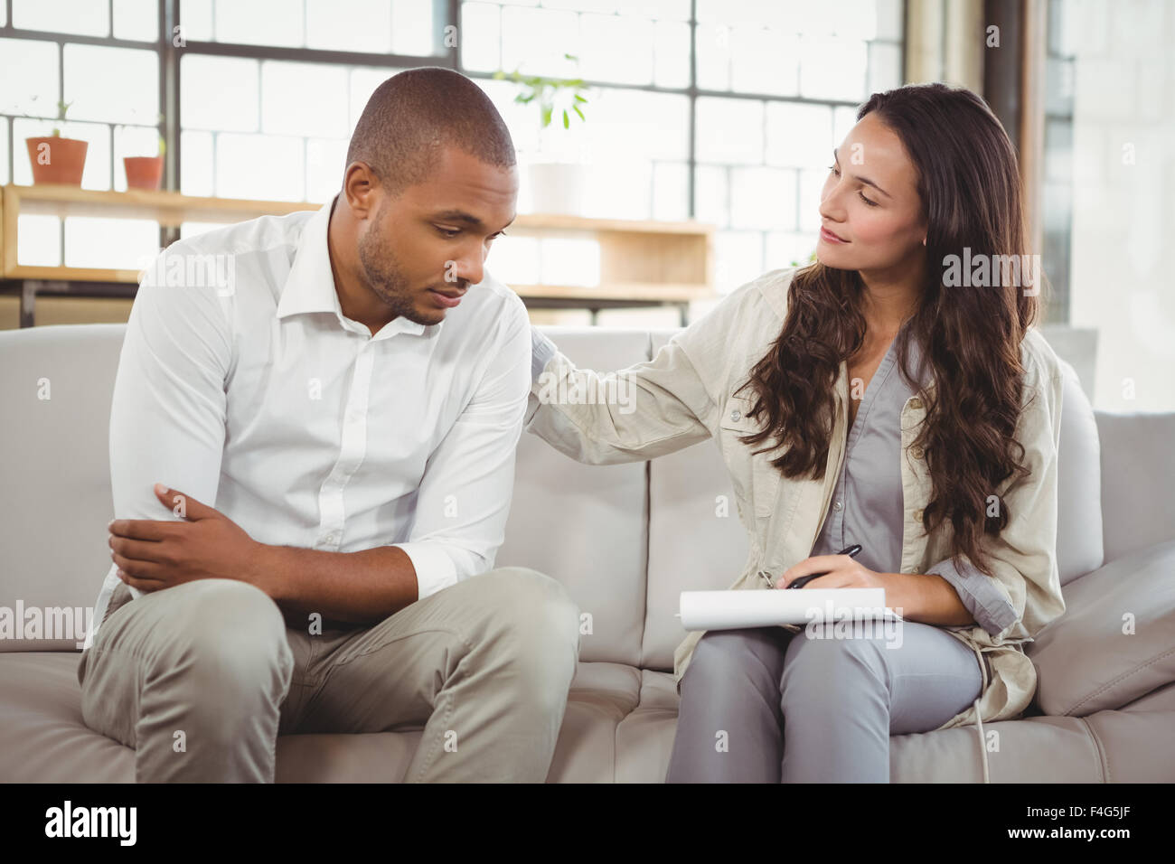 Therapist counselling patient Stock Photo