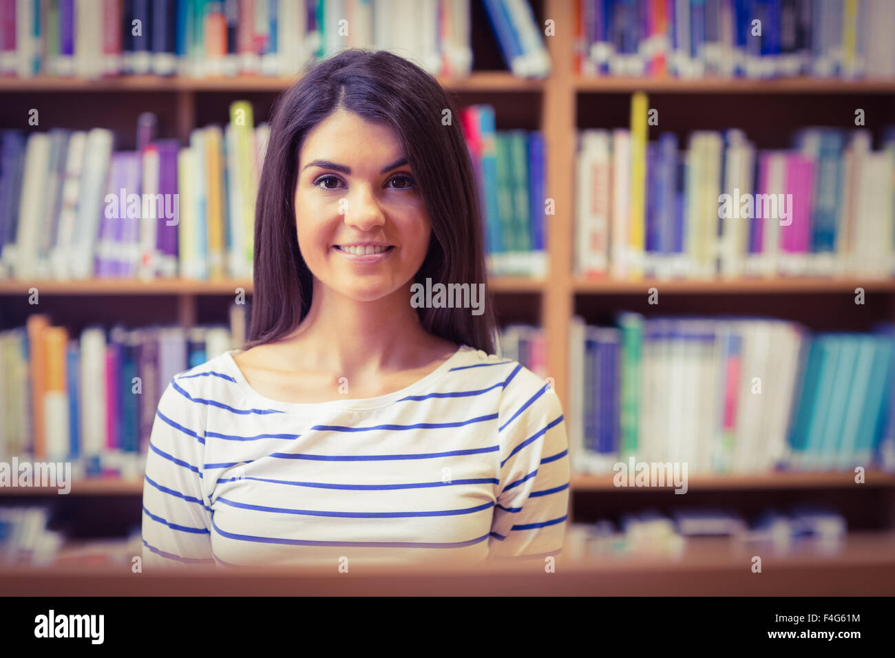 Confident female student in library Stock Photo