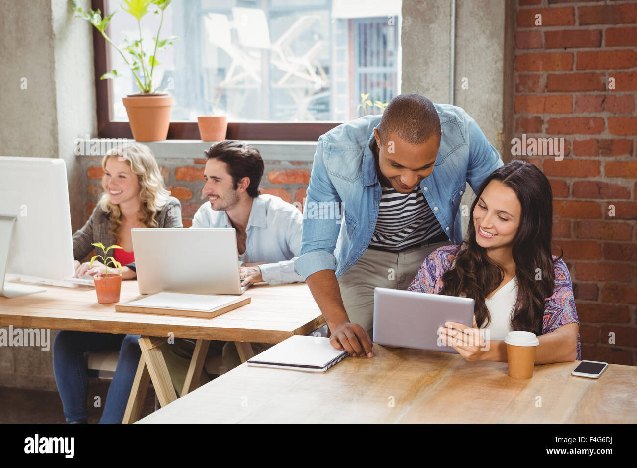 Happy creative team working at office Stock Photo