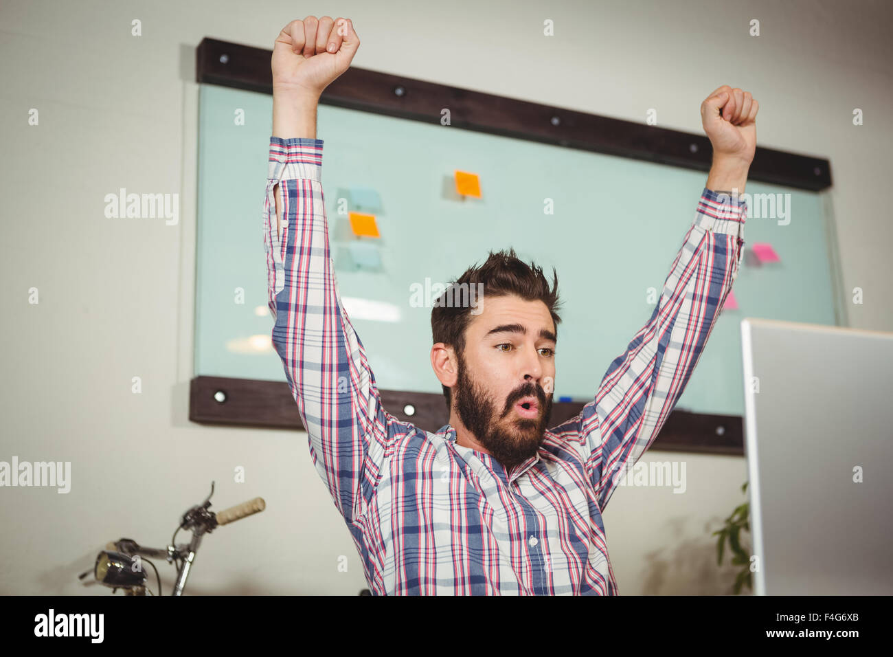 Low angle view of businessman with arms raised Stock Photo