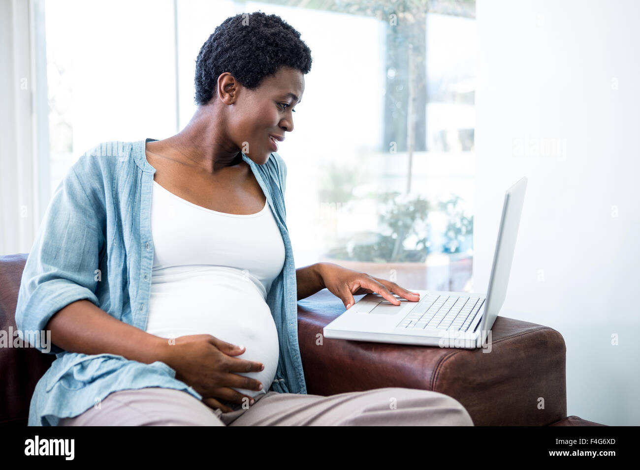 Smiling black woman laptop hi-res stock photography and images - Alamy