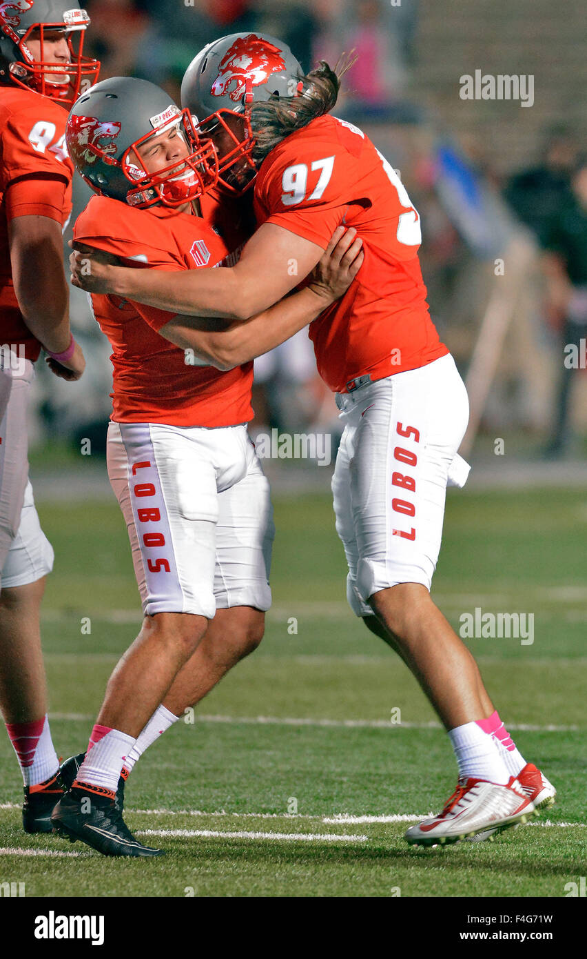 Albuquerque, NM, USA. 17th Oct, 2015. UNM's #90 Zack Rogers is congratulated by teammate #97 Steven Romero after making the extra point kick in the final minutes of the game Saturday night as UNM beat Hawaii 28-27. Saturday, Oct. 17, 2015. © Jim Thompson/Albuquerque Journal/ZUMA Wire/Alamy Live News Stock Photo