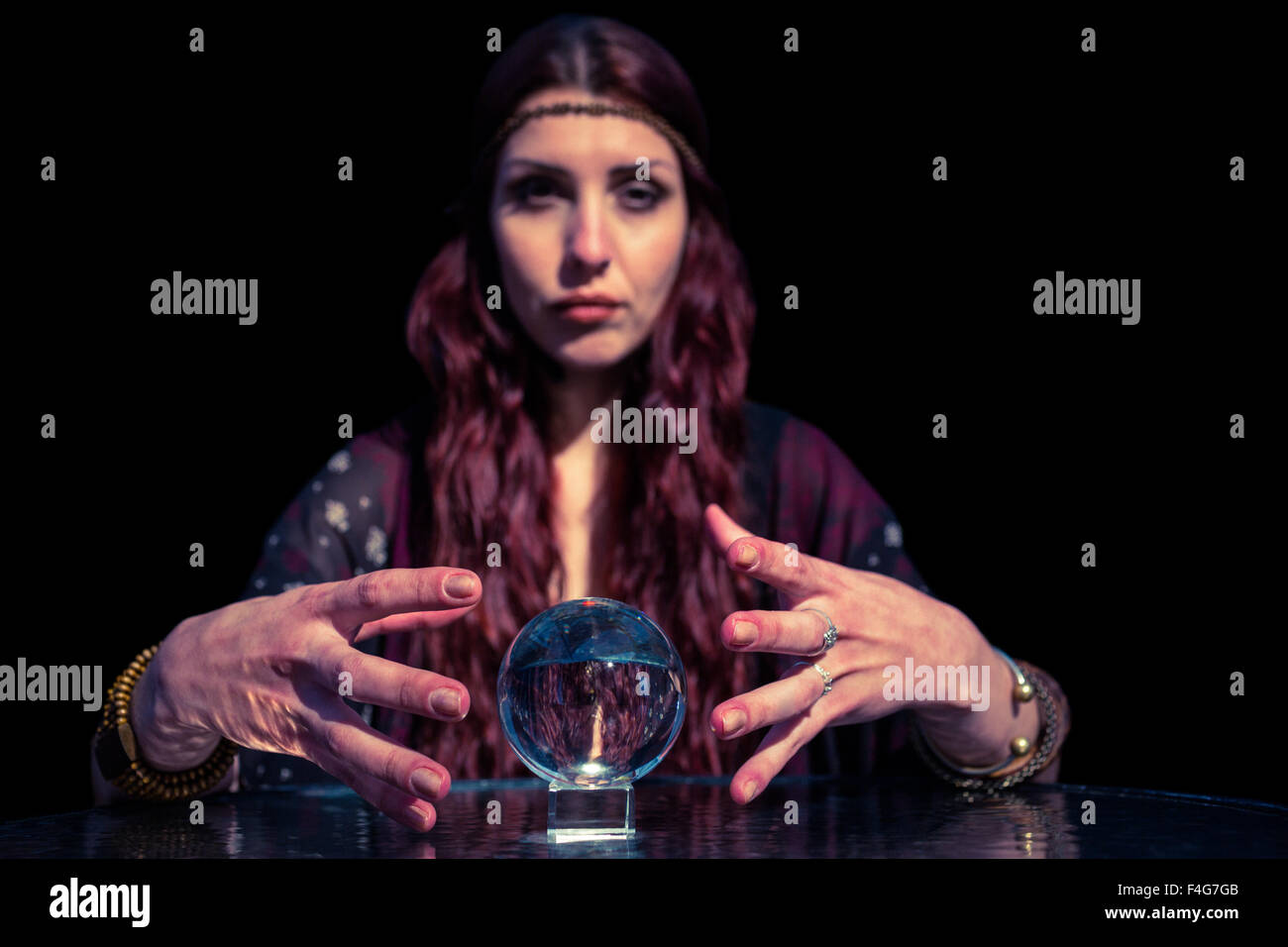 Serious fortune teller using crystal ball Stock Photo Alamy