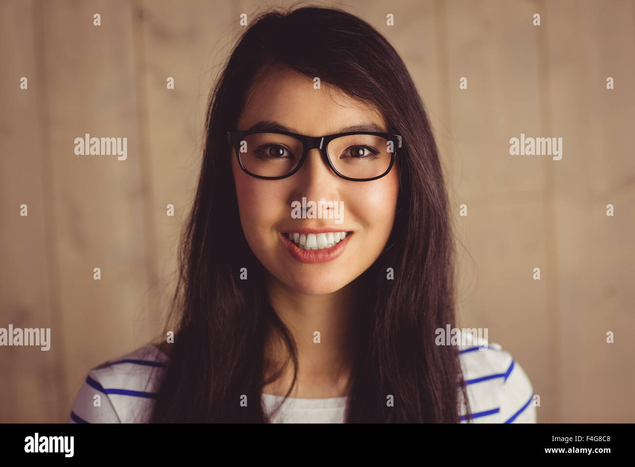 Smiling attractive woman posing for camera Stock Photo