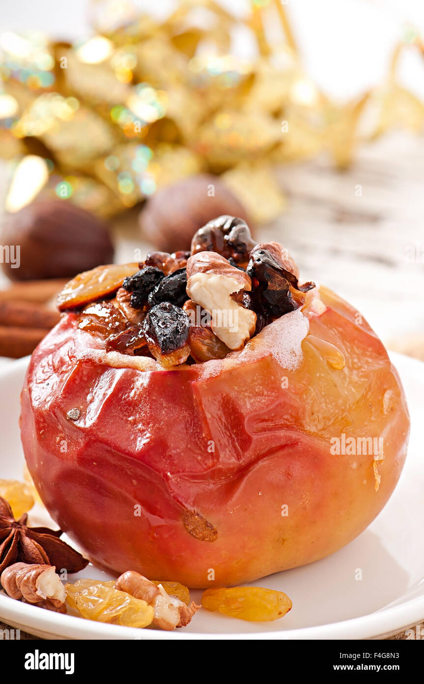 Baked apples with raisins, nuts and honey Stock Photo - Alamy