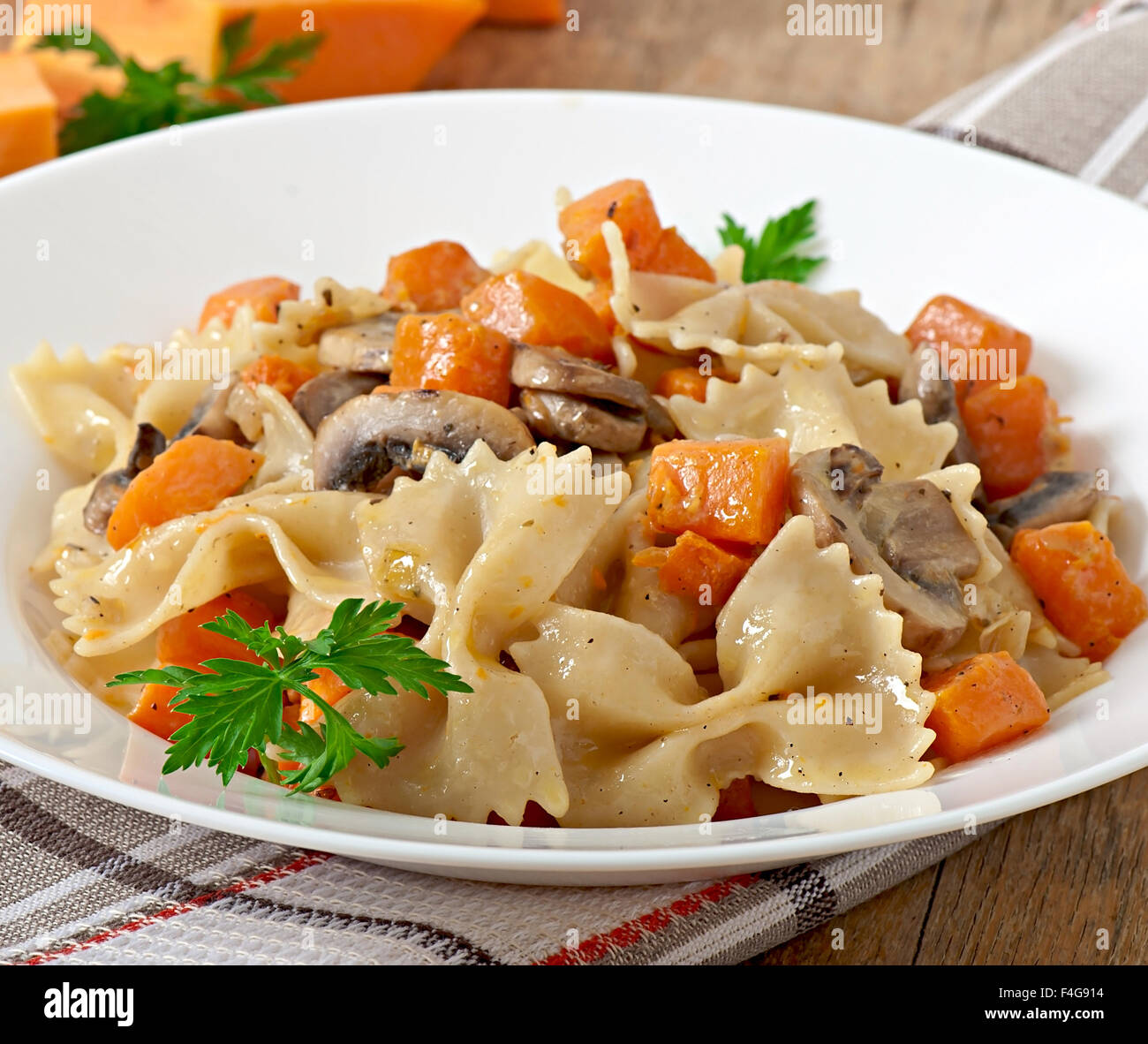 Pasta In Cream Sauce With Slices Of Pumpkin And Mushroom Stock Photo Alamy
