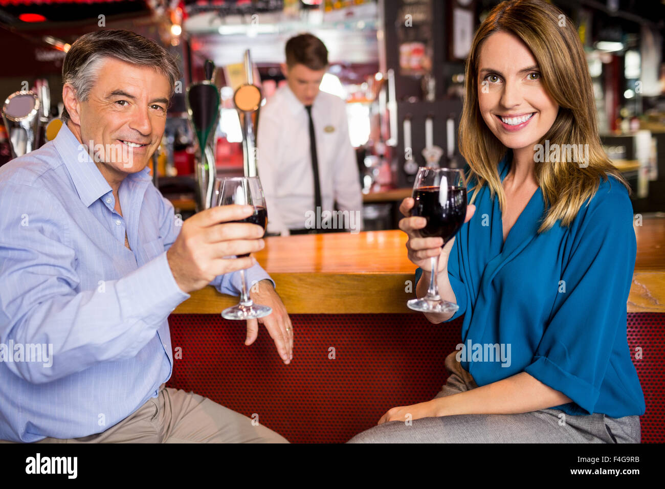 Colleagues having a drink after work Stock Photo