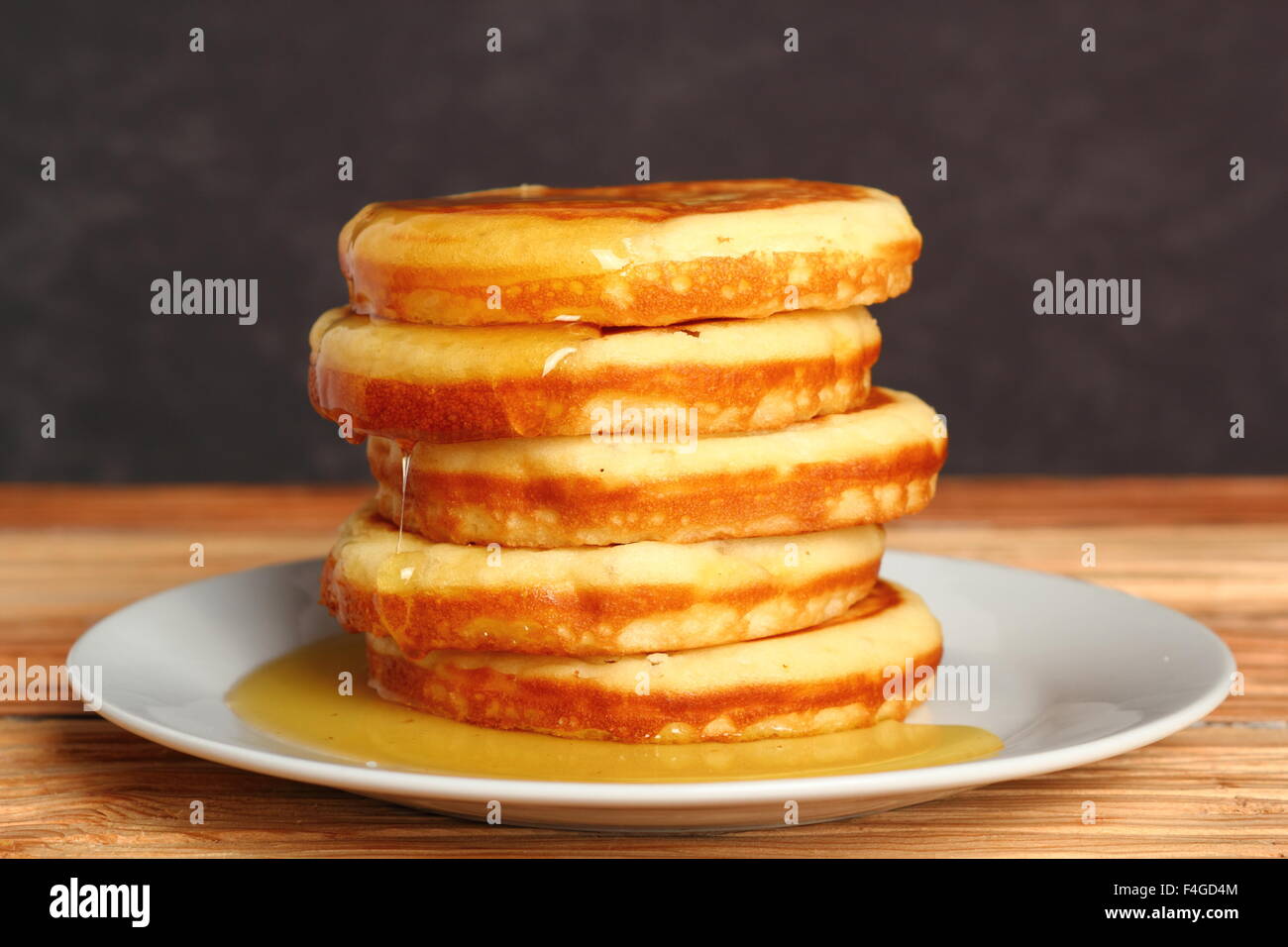 American pancakes with Honey Stock Photo Alamy