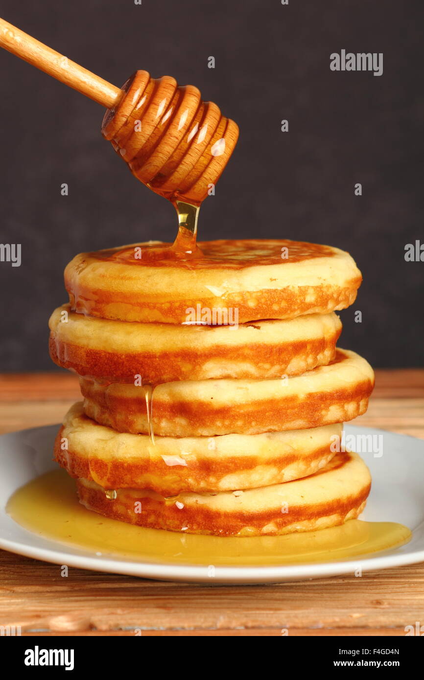 American pancakes with Honey Stock Photo Alamy