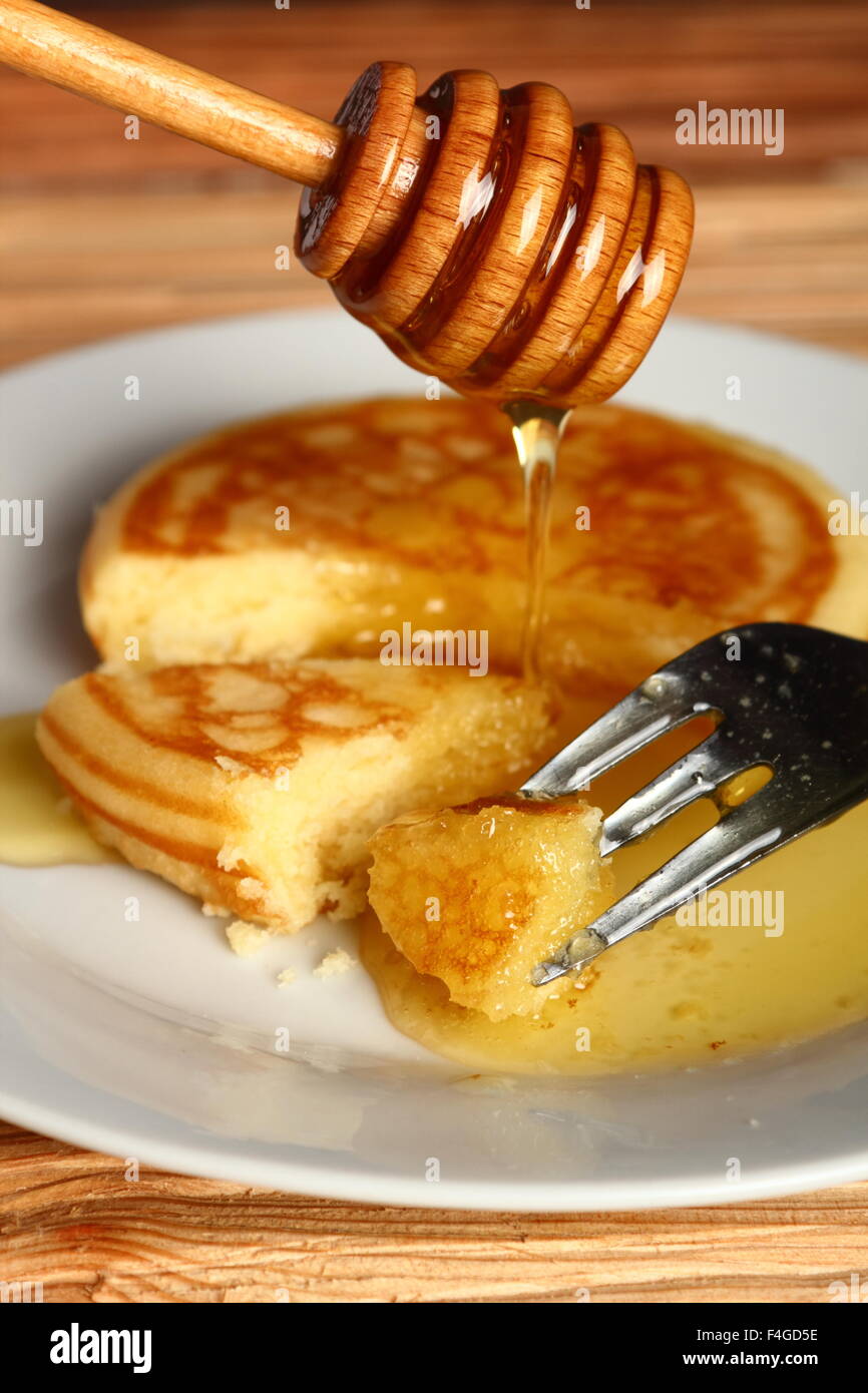 American pancakes with Honey Stock Photo Alamy