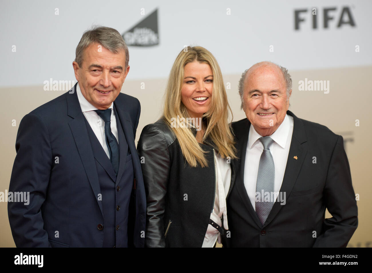 Sony Center, Potsdamer Platz, Berlin, Germany. 10th Nov, 2014. President of the German Football Association Wolfgang Niersbach (L) and his girlfriend Marion Popp arrive with FIFA President Joseph Blatter (R) for the world premiere of the film 'Die Mannschaft' (lit. 'The team') at the Cinestar movie theater at Sony Center, Potsdamer Platz, Berlin, Germany, 10 November 2014. The film is the official documentary of the FIFA Soccer World Championship 2014 in Brazil. PHOTO: Joerg Carstensen/dpa/Alamy Live News Stock Photo