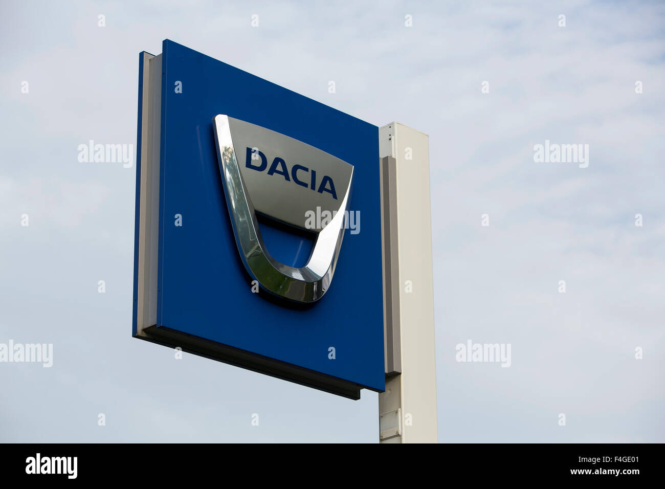 A logo sign outside of an Automobile Dacia vehicle dealership in Amsterdam, Netherlands on October 3, 2015. Stock Photo