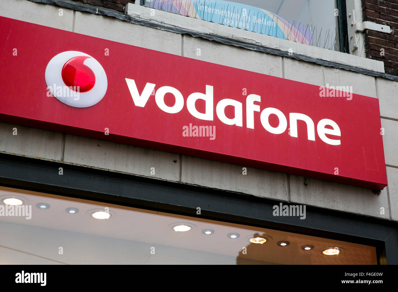 A logo sign outside of a Vodafone retail store in Haarlem, Netherlands on October 5, 2015. Stock Photo