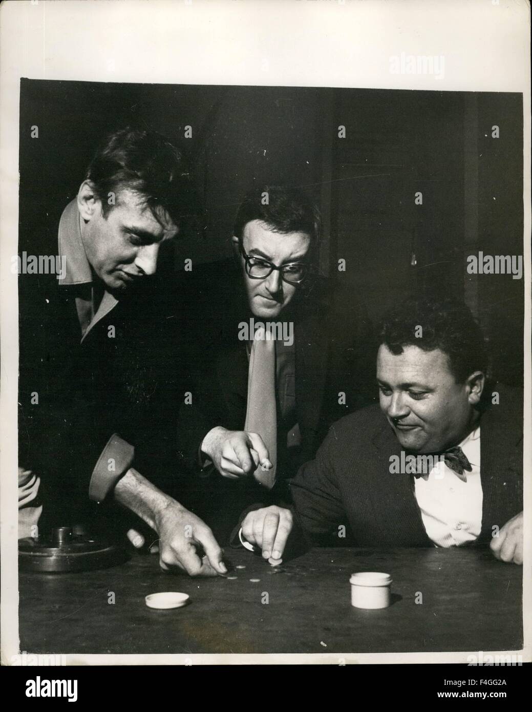 Feb. 24, 1968 - Practising for Saturday's ''Tiddlywinks'' match.: The ''Tiddly - Winks'' challenge match between ''The Goona'', whom the Duke Of Edinburgh appointed to represent him - and Cambridge University, takes place on Saturday at Cambridge. The Goonas will be skippered by Spike Milligan. Photo shows the Goons team get in a spot of practise in readiness for Saturday's ''battle''. (L to R): Spike Milligan, Peter Sellars and Harry Secombe. © Keystone Pictures USA/ZUMAPRESS.com/Alamy Live News Stock Photo