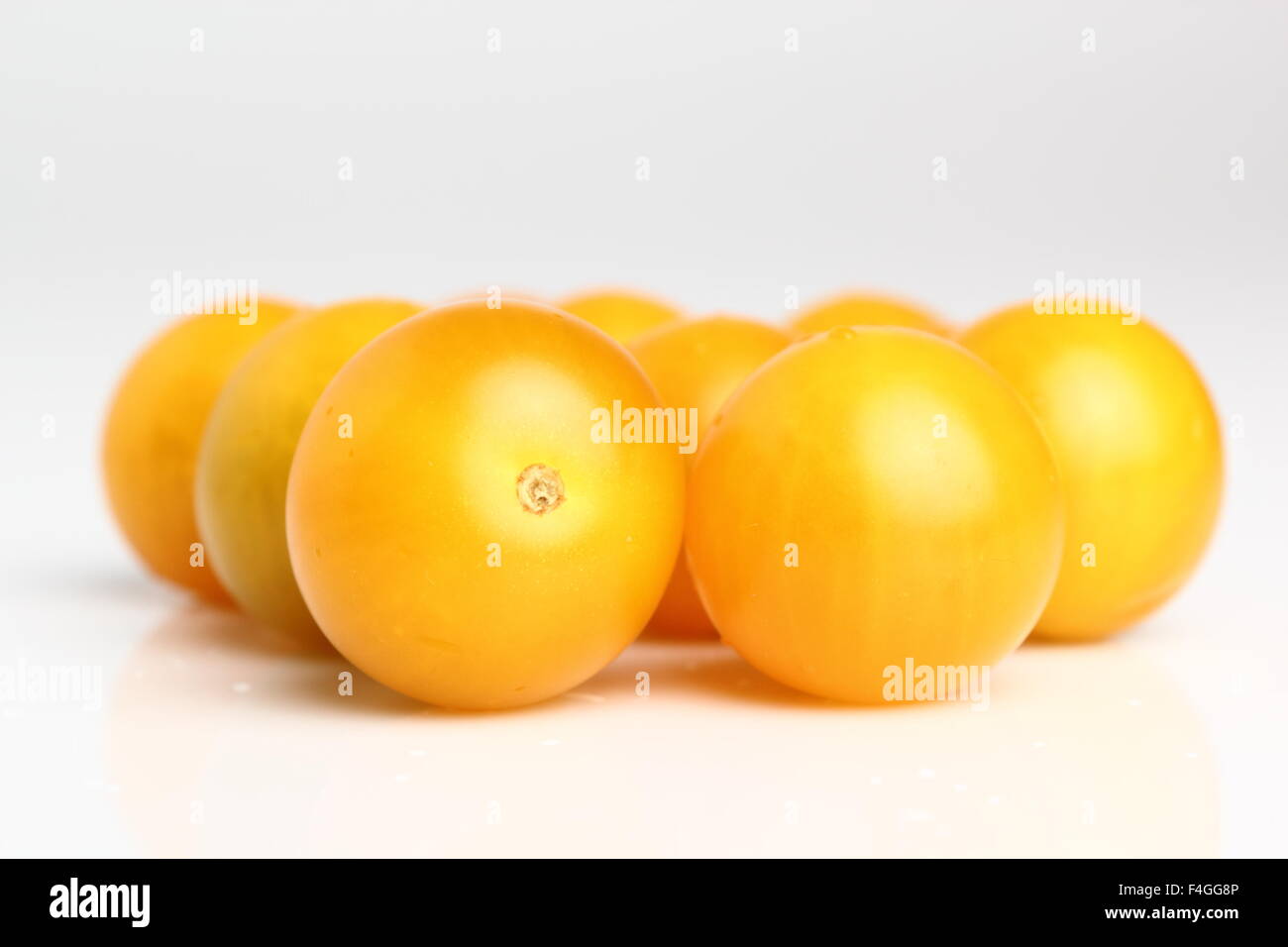 Yellow currant tomatoes isolated on a white background. Macro. Stock Photo