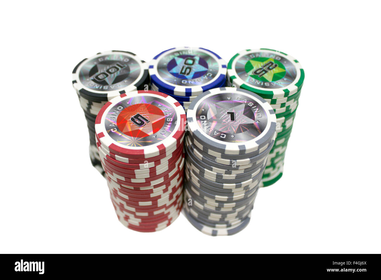 Casino gambling chips stacked and isolated on white background. Stock Photo