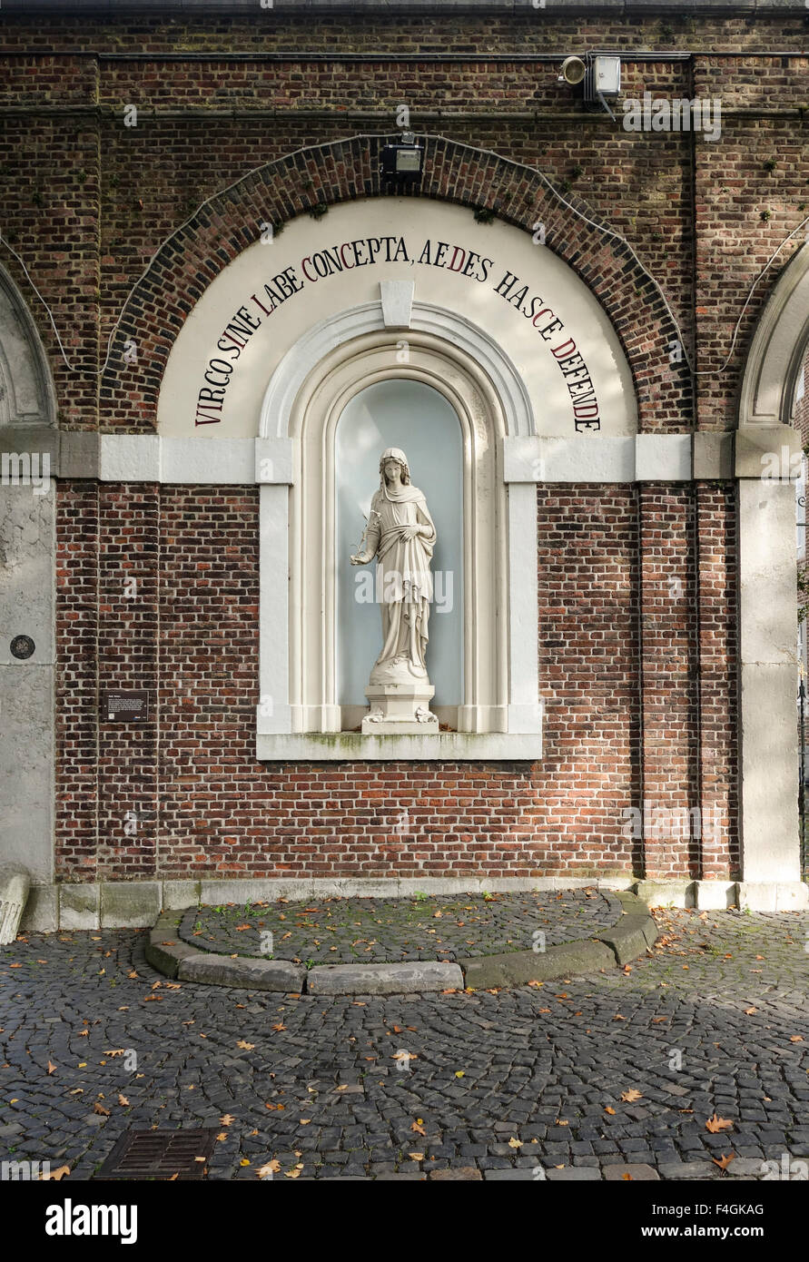 Entrance with statue of virgen Mary of Rolduc medieval abbey, Kerkrade, Limburg, Netherlands Stock Photo