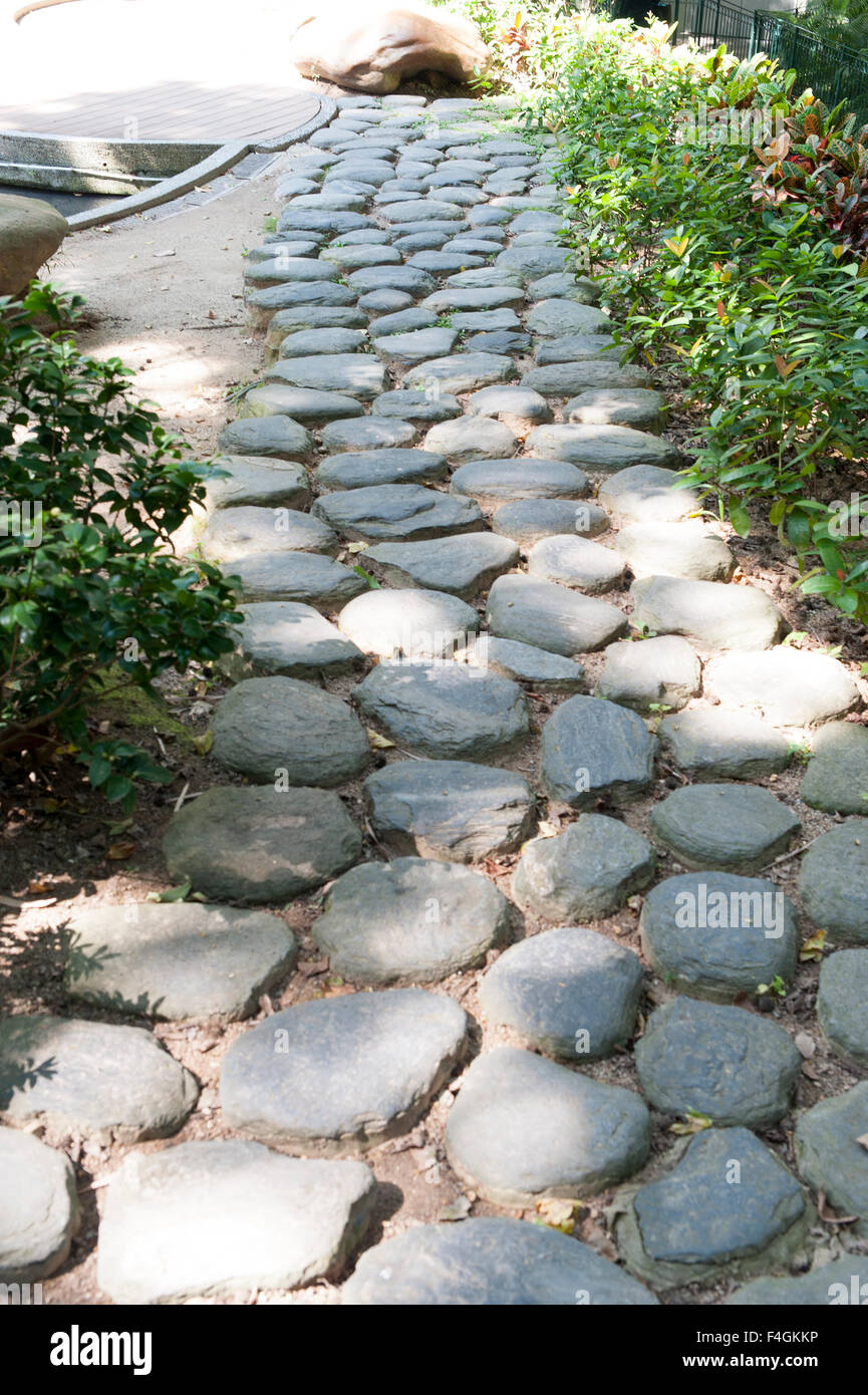 Rocky path in the middle of a garden Stock Photo