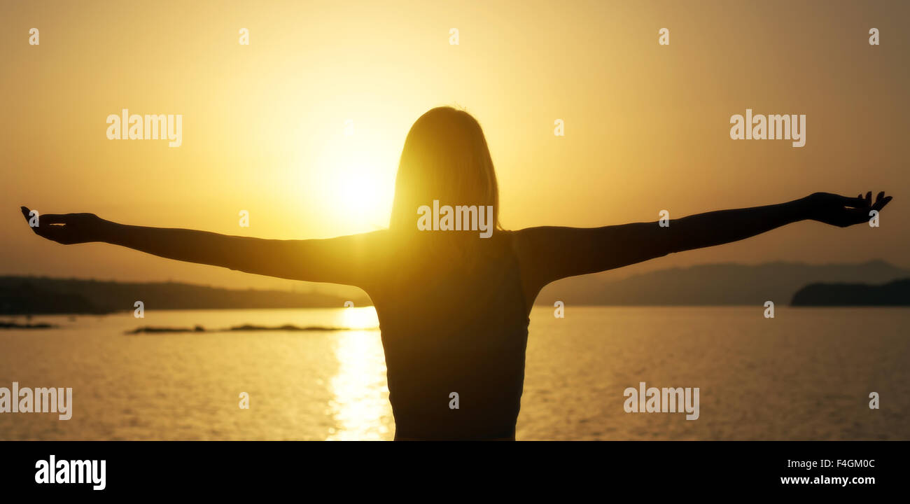 Woman sunset sky arms hi-res stock photography and images - Alamy