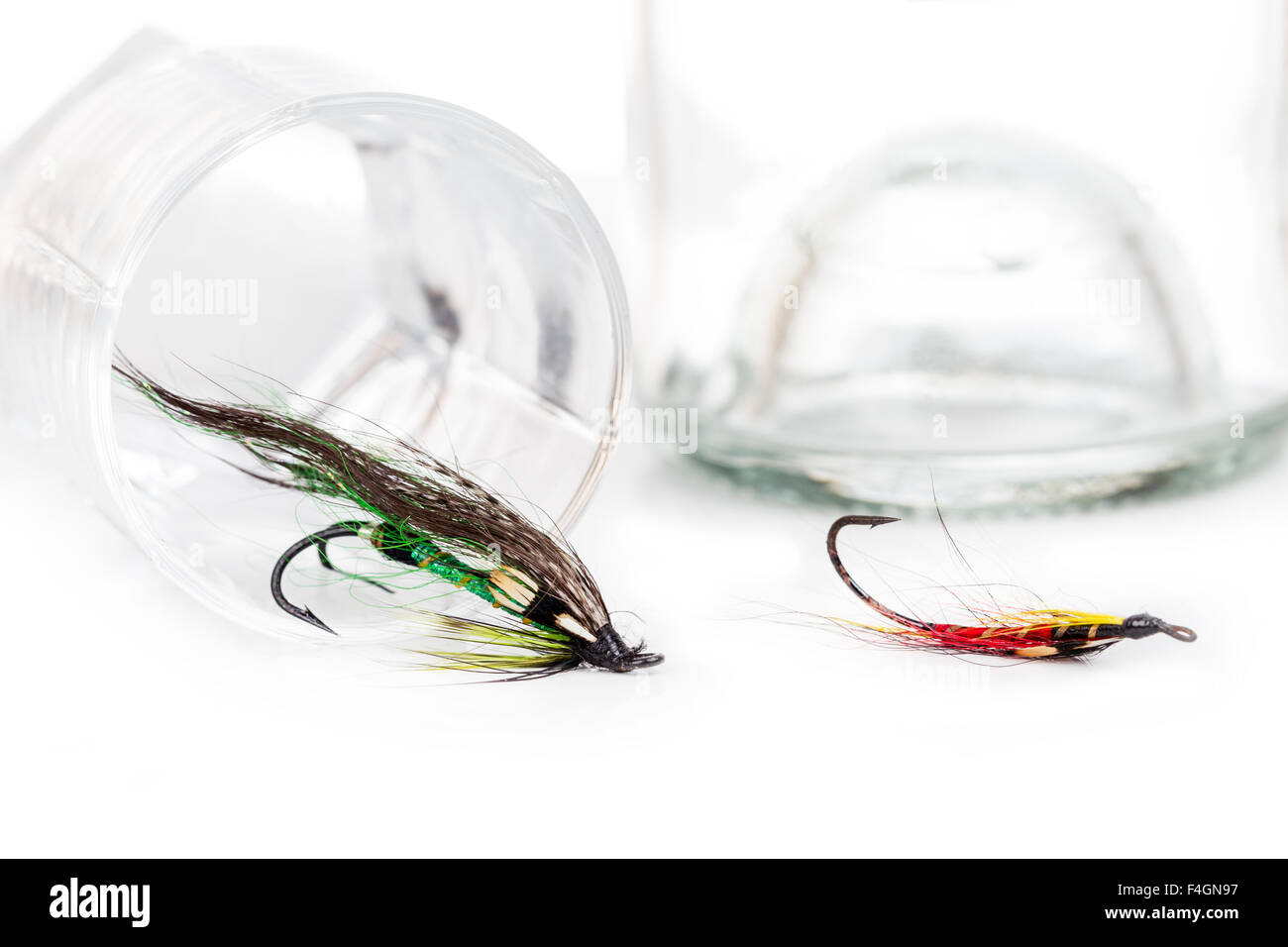 fly fishing bait with glass and bottle with white alcohol Stock Photo