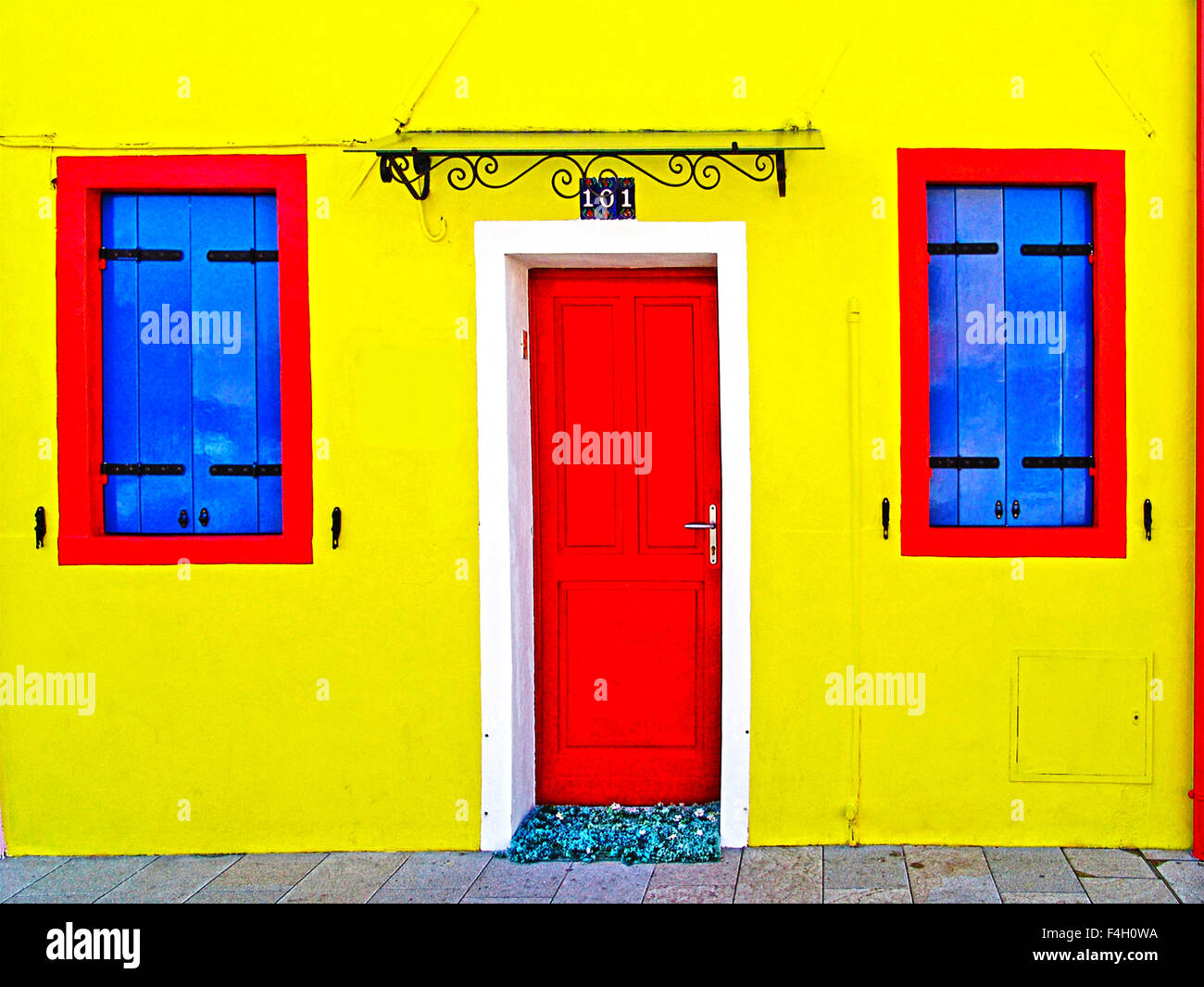 Burano Italy Yellow House With Blue Shutters And Red Wooden Door