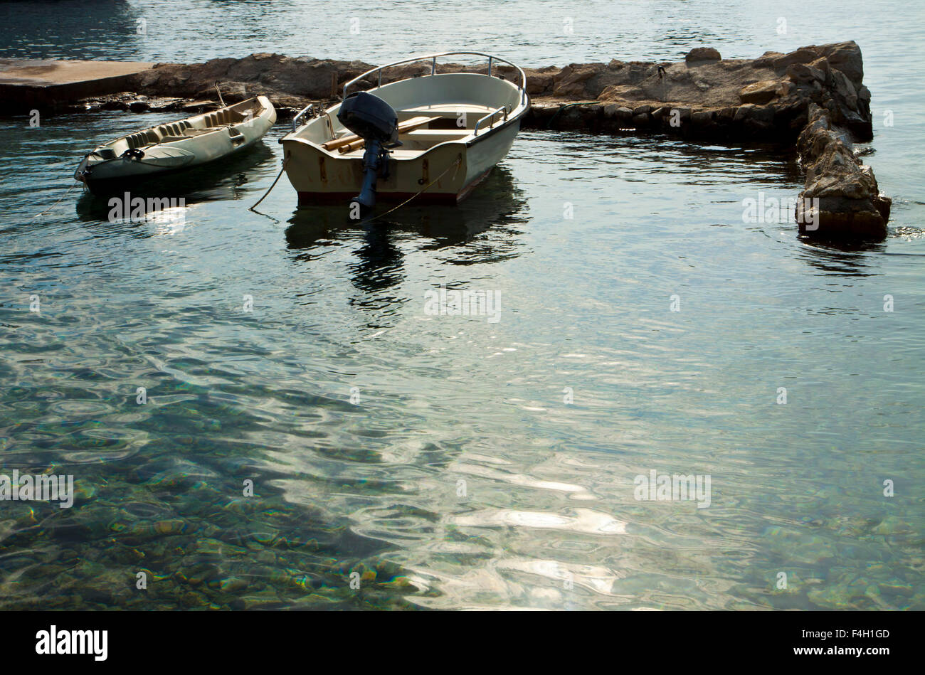 Small Plastic Boats Moored At The Pier A Quiet Morning On A Fishing Pier  Motor Boats And Boats By The Shore Stock Photo - Download Image Now - iStock